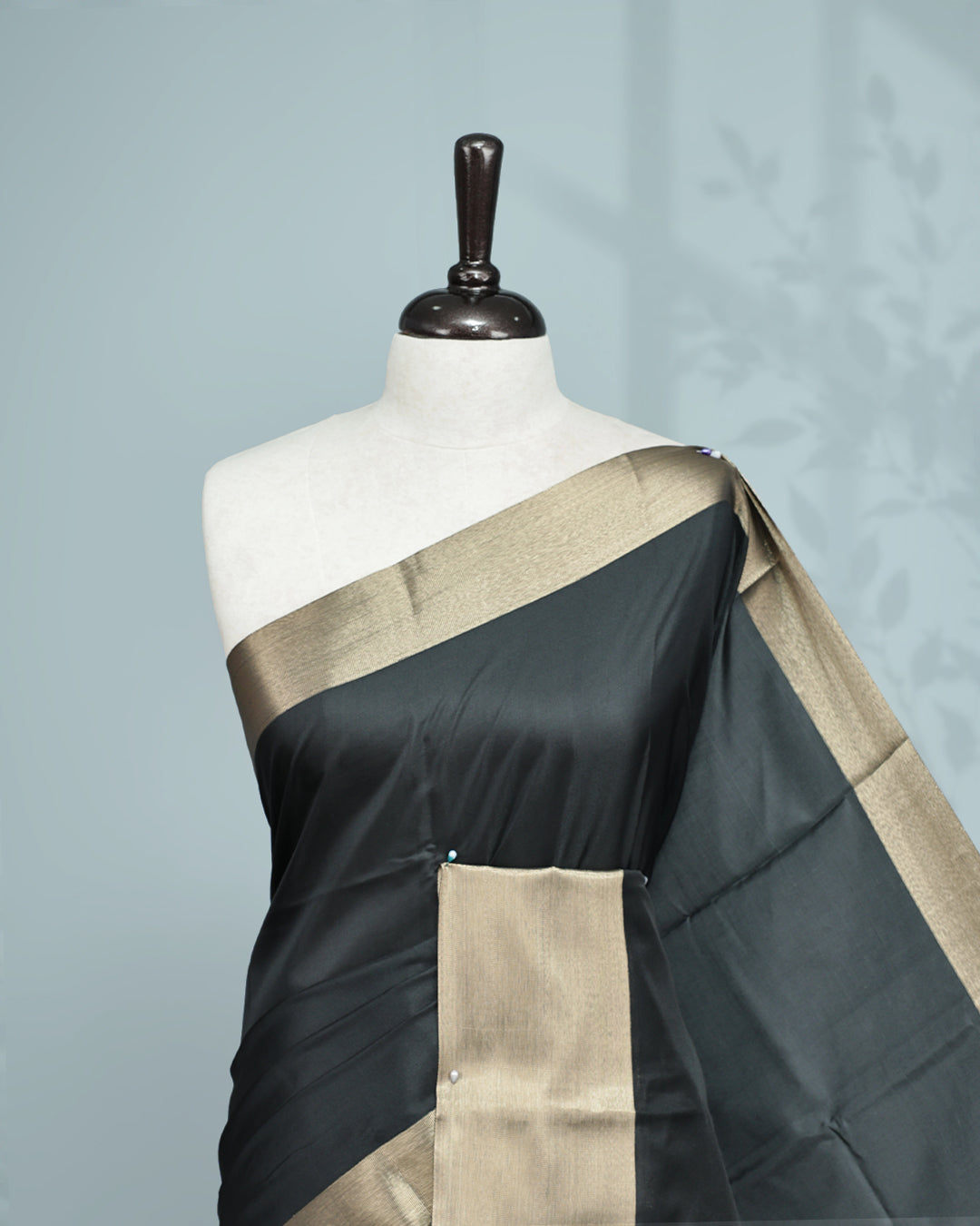 Black colour saree featuring a plain body, complemented by a Bavanchi border and contrast pallu, paired with a matching blouse piece.