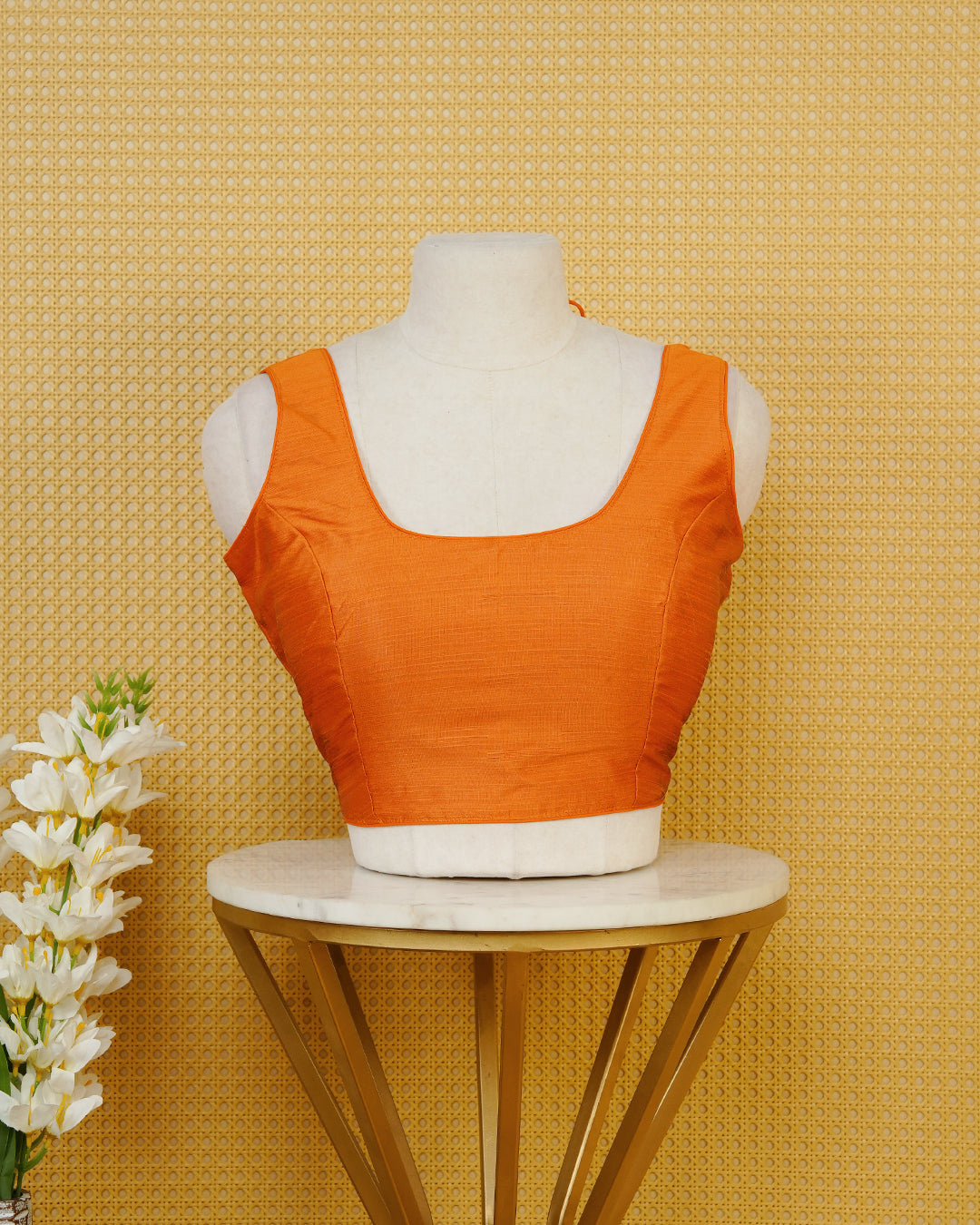 Orange Colour Plain Blouse Featuring A Classic U Neckline, Sleeveless Design, And A Simple, Clean Finish.
