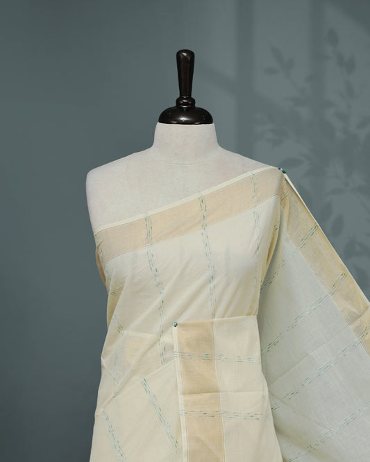 Cream colour Cotton kerala saree featuring Green & gold Strips on body, complemented by Gold zari Border, paired with matching blouse piece.
