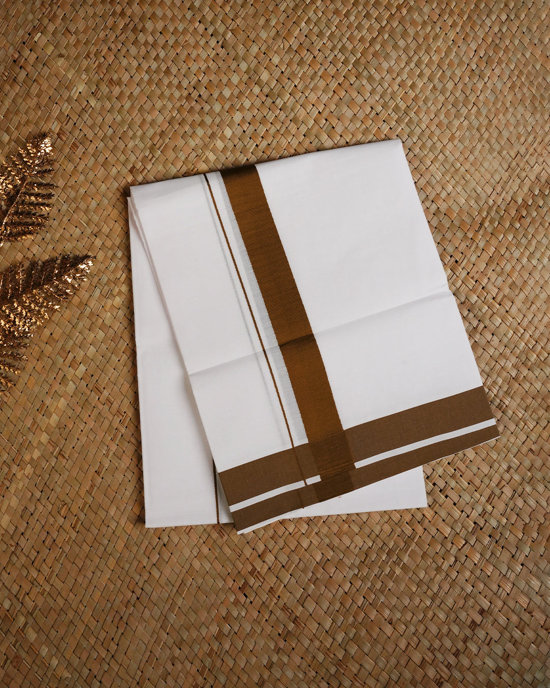 White colour cotton single dhoti featuring Brown border.