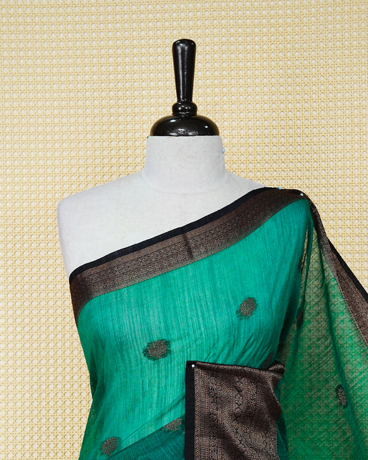Bottle green colour semi linen saree thread motifs on body, contrast black colour gold zari border, rich pallu comes with matching blouse piece