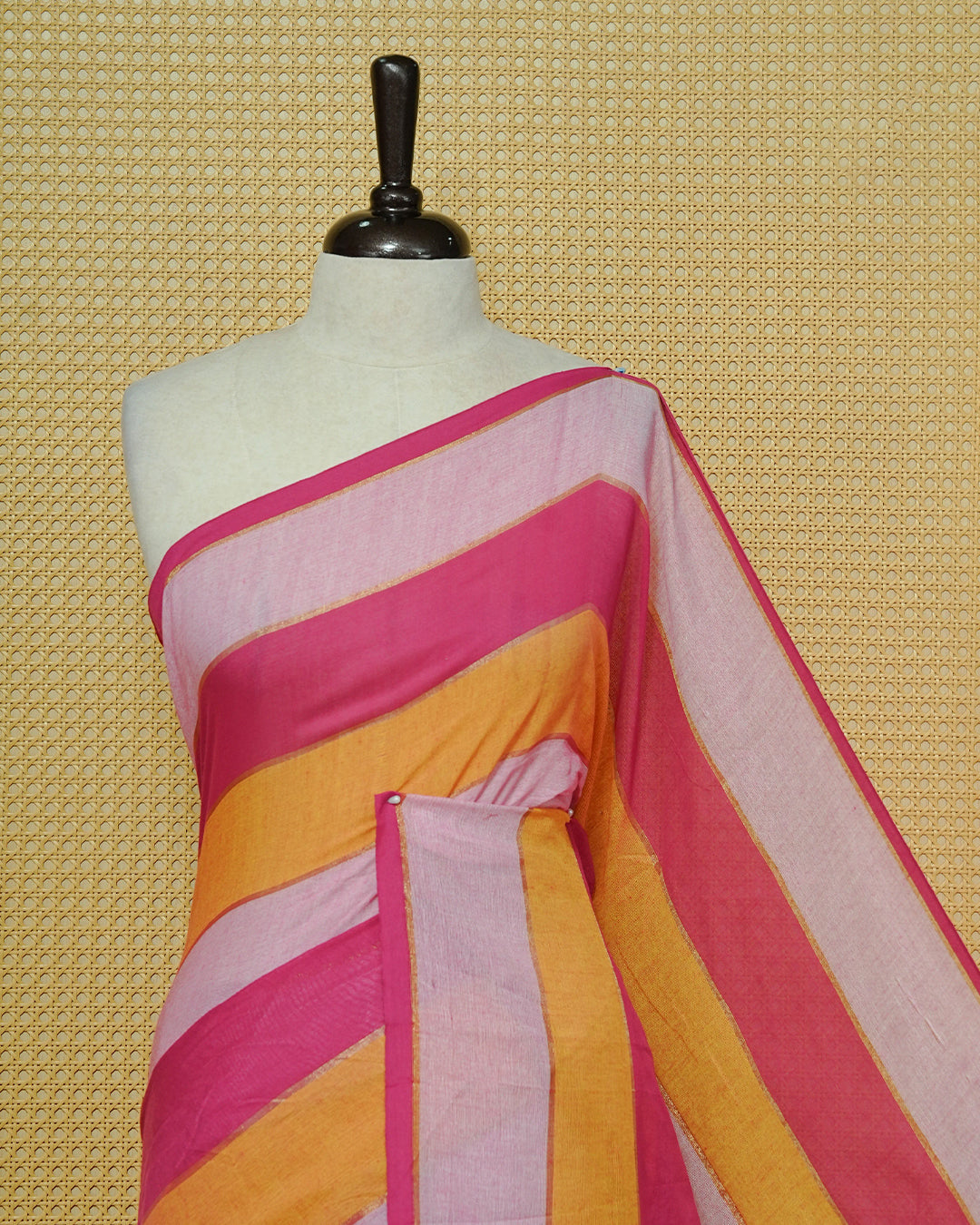 Pink & Mustard  Colour Mul Cotton Saree featuring bold striped patterns in Magenta, mustard, and soft pink, accented with subtle zari lines and finished with white tassels.