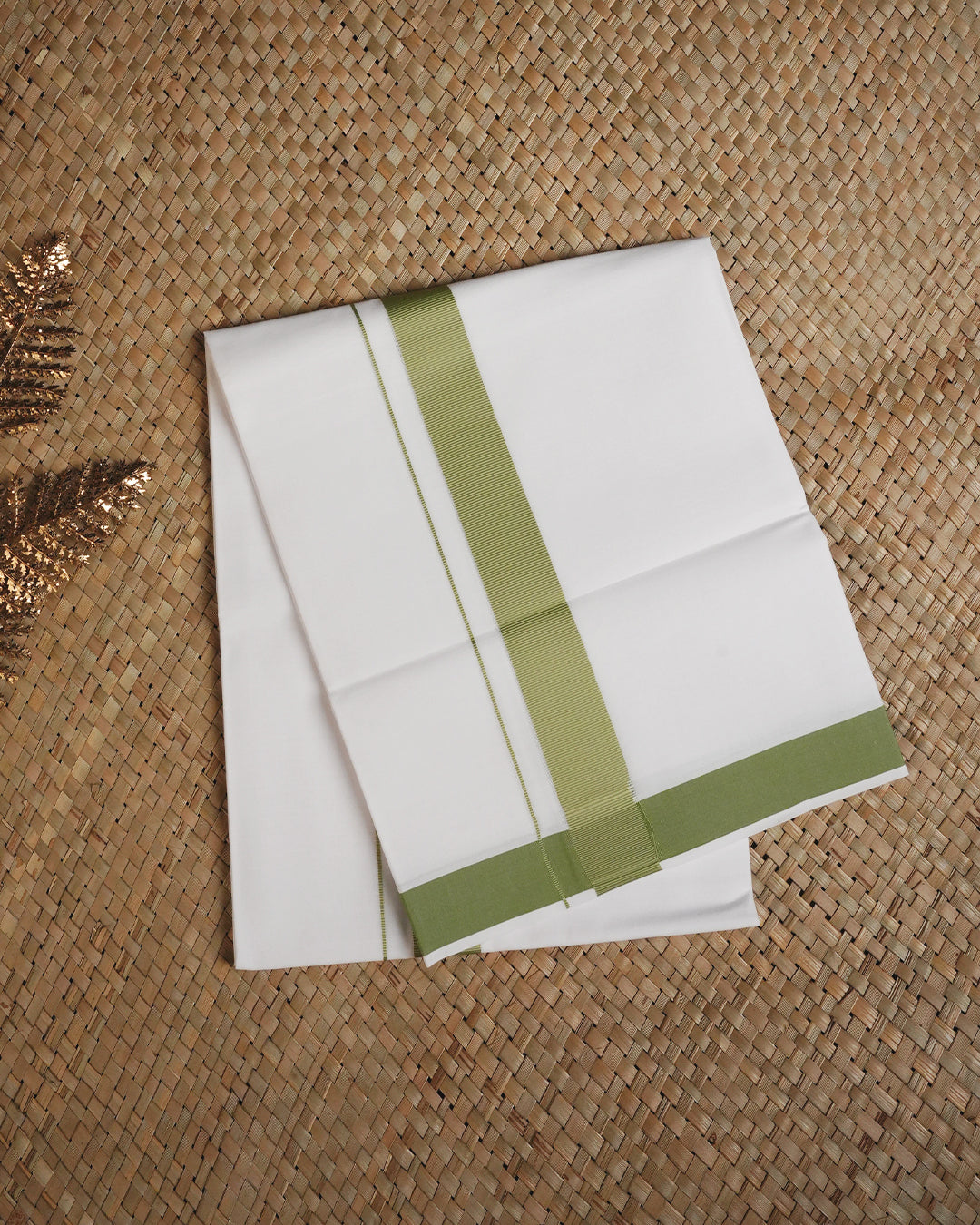 White colour cotton single dhoti featuring light green border.
