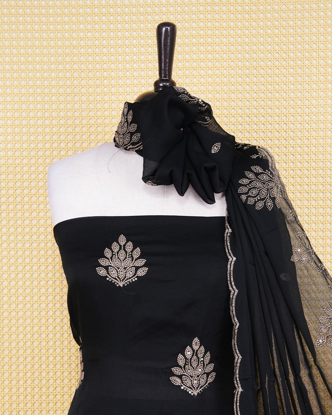 Black Georgette Salwar material Featuring Intericate Gold Emproidary Leaf Motifs and scalloped Border Work Highlighted With subtle sequin Accents, paired with a matching bottom & elegant Duptta
