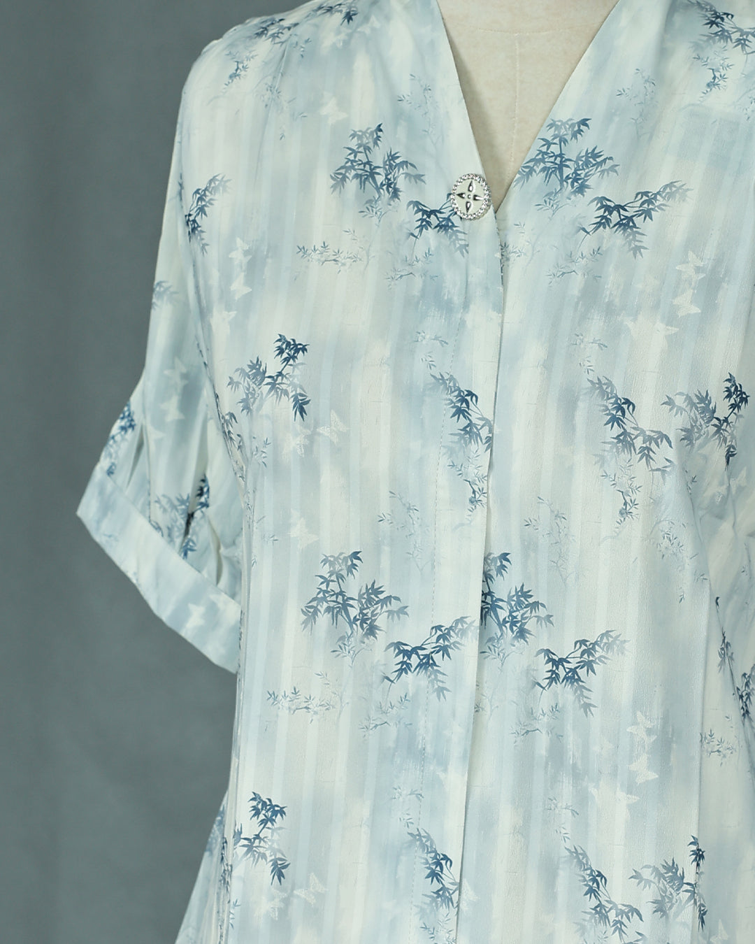 Light Blue colour Top with Leaf Print work on body, collar design, With sleeve.