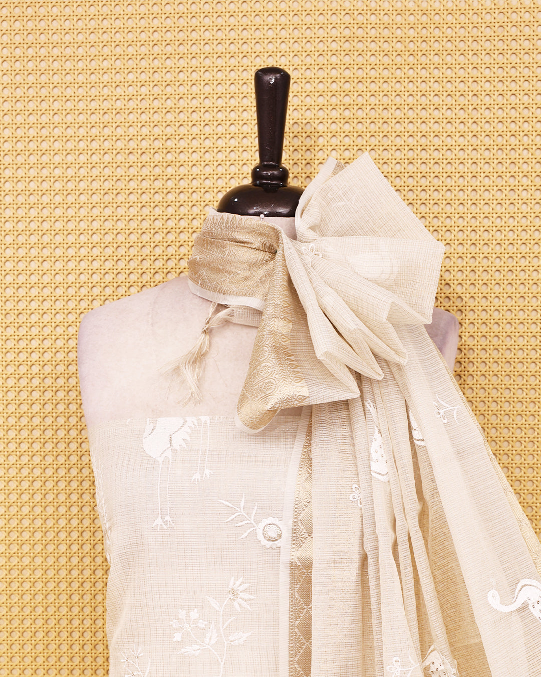 White colour Net Kota Salwar material on thread work on body, paired with matching bottom & Dupatta.