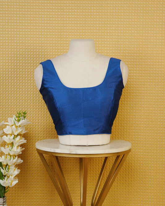 Blue Colour Plain Blouse Featuring A Classic U Neckline, Sleeveless Design, And A Simple, Clean Finish.