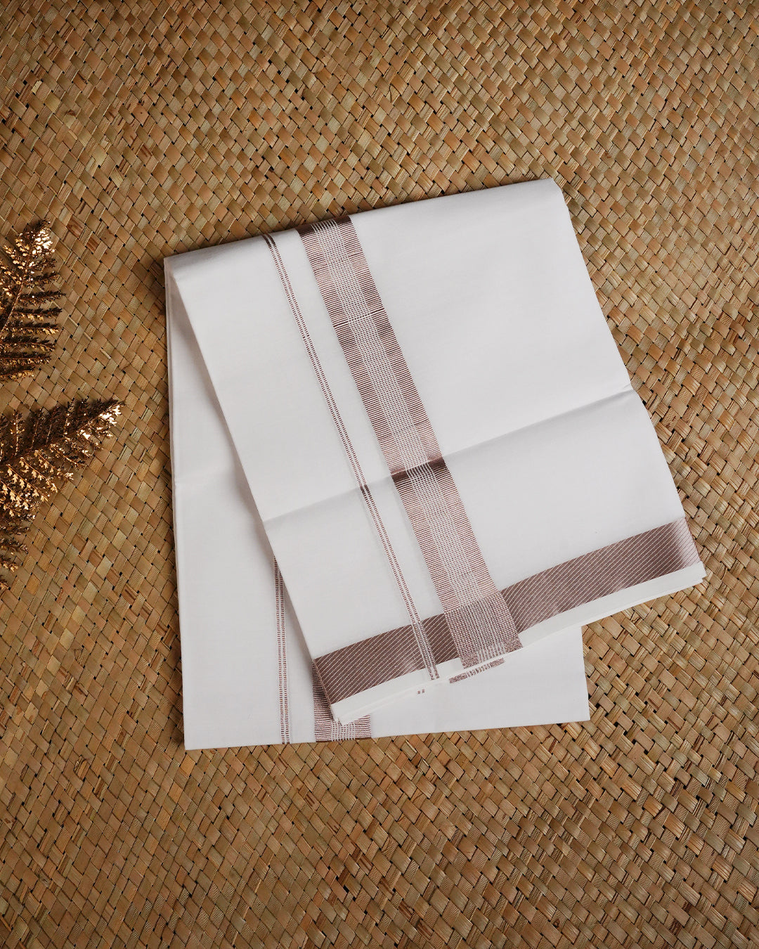 White colour cotton single dhoti featuring Rose gold Kasav border.