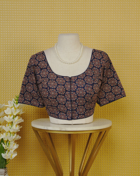 Blue Colour Blouse Featuring A Classic U-Neck, Intricate Floral Geometric Print, And Comfortable Elbow Length Sleeves.