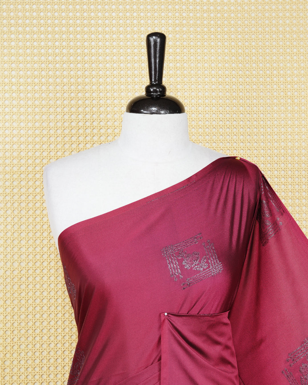 Maroon colour soft silk saree featuring antique zari motifs on body with contrast dark purple colour pallu & paired with matching blouse piece.