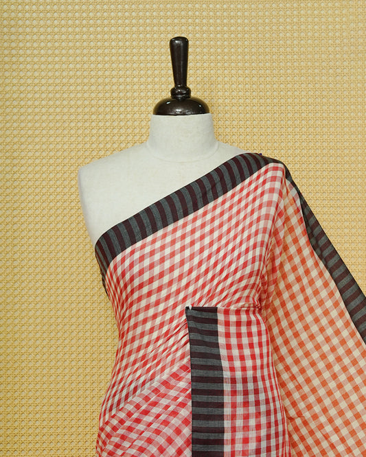 Red & Off-White Checked Mul Cotton Saree featuring an elegant all-over checked pattern, complemented by a black striped contrast border and matching black tassels.