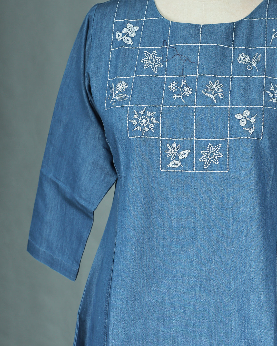 Light Blue Denim Design Colour Kurti featuring Thread Box with Floral motifs Work On body , a U neckline, With sleeve.