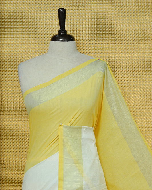 Yellow & White Colour Half & Half Mul cotton saree Complemented by contrast colour Gold Zari Border & tassels.