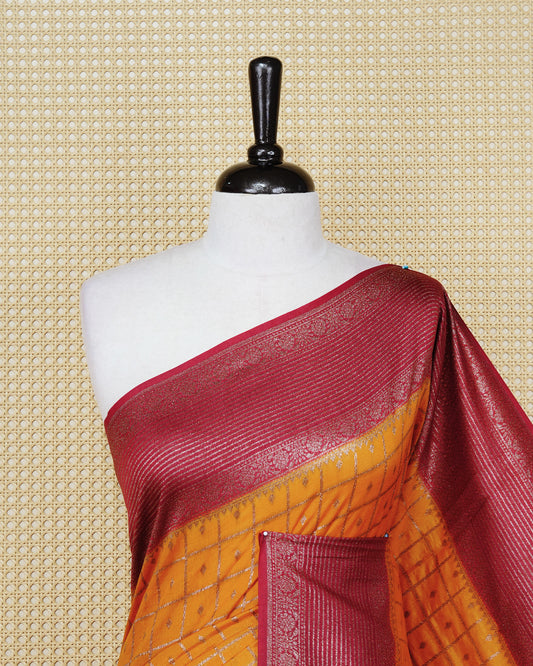 Mustard yellow Colour Semi georgette Saree having zari check with buttas pattern on body, contrast maroon colour floral designed border, Rich Pallu comes with Matching Blouse piece.
