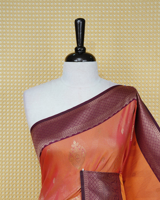 Rust orange & gold double shade Mulberry silk saree featuring gold floral zari patterns on body , paired with contrast magenta colour with traditional border, comes with matching blouse piece.