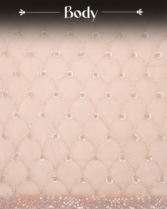 Peach colour designer saree featuring intricate bead and sequin work on the body and border, paired with a matching blouse piece.