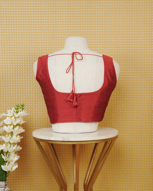Red colour Sleeveless Blouse Featuring A Classic Scoop Neck, Smooth Finish, And A Comfortable Tailored Fit.