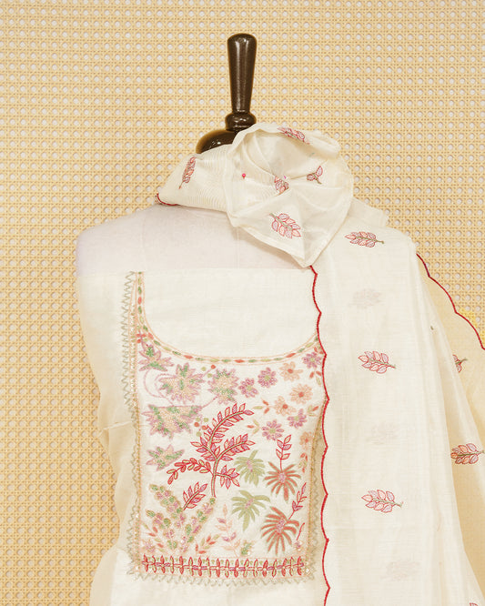 Cream tissue salwar material featuring elegant floral embroidery pattern adorned with beadwork, paired with matching bottom and elegant dupatta.