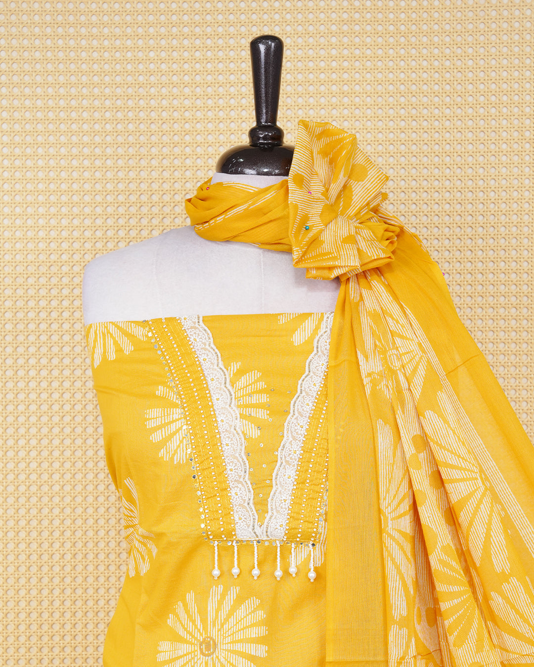 Yellow colour salwar material featuring Motifs and Beadswork on Body Design without border, paired with matching bottom and an elegant dupatta.