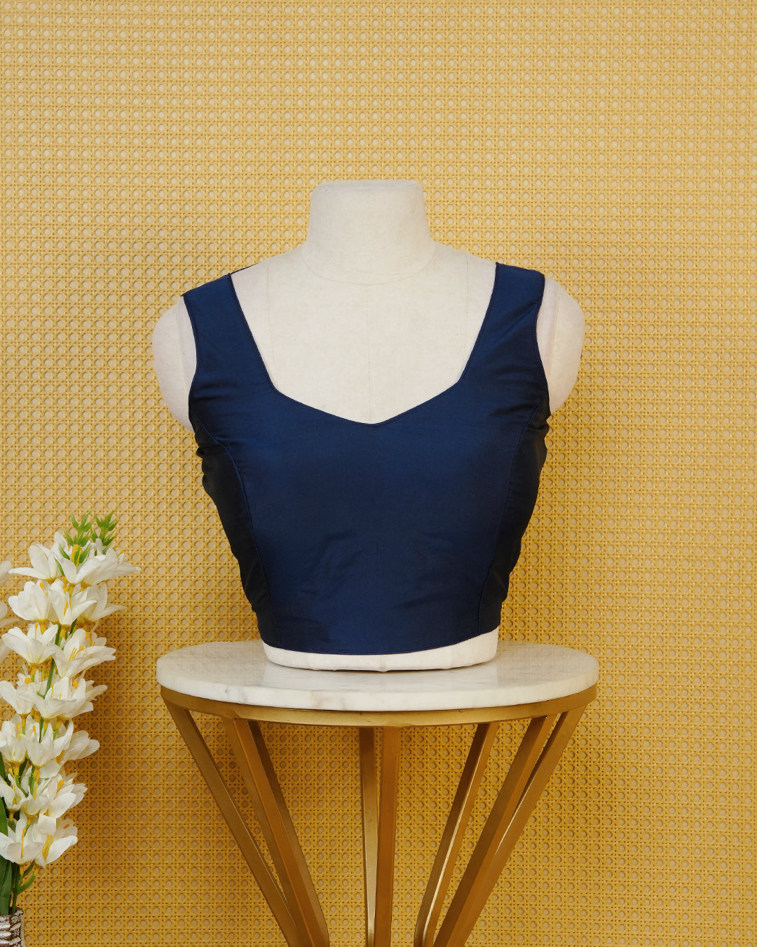 Blue colour Sleeveless Blouse Featuring A Stylish Sweetheart Neck, Smooth Finish, And A Comfortable Tailored Fit.