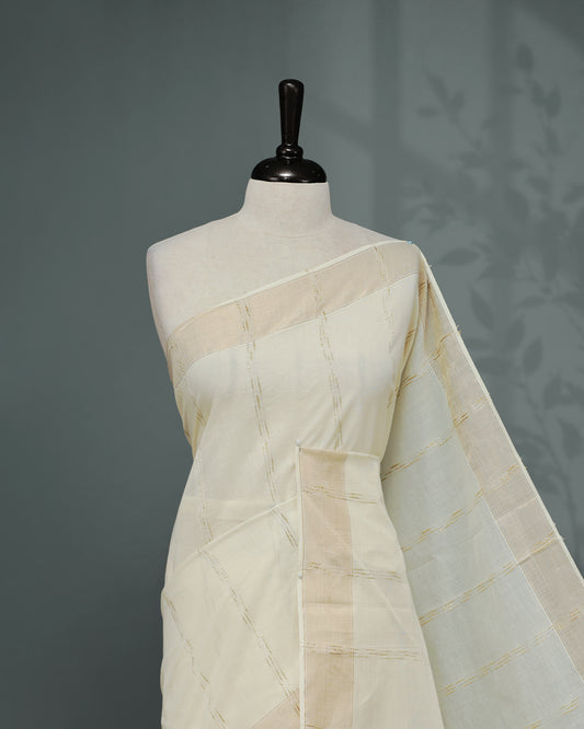 Cream colour Cotton kerala saree featuring Gold Embroidery strips on the body, complemented by a gold zari Border, Yellow elegant tassels, paired with a matching blouse piece.