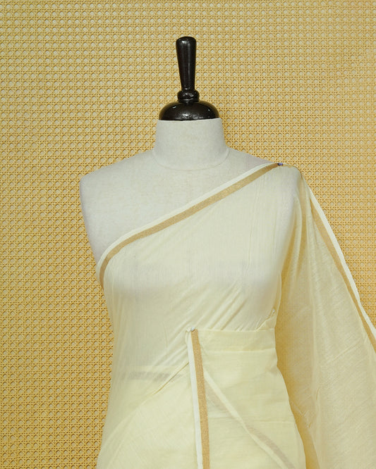 Cream Mul Cotton Saree featuring an elegant plain body, complemented by a subtle gold zari border and sky blue tassels.
