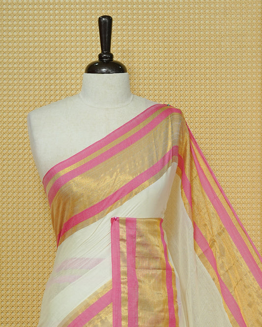 Off White Mul Cotton Saree featuring a gold zari border with pink stripes, A Matching Pallu & finished with pink tassels