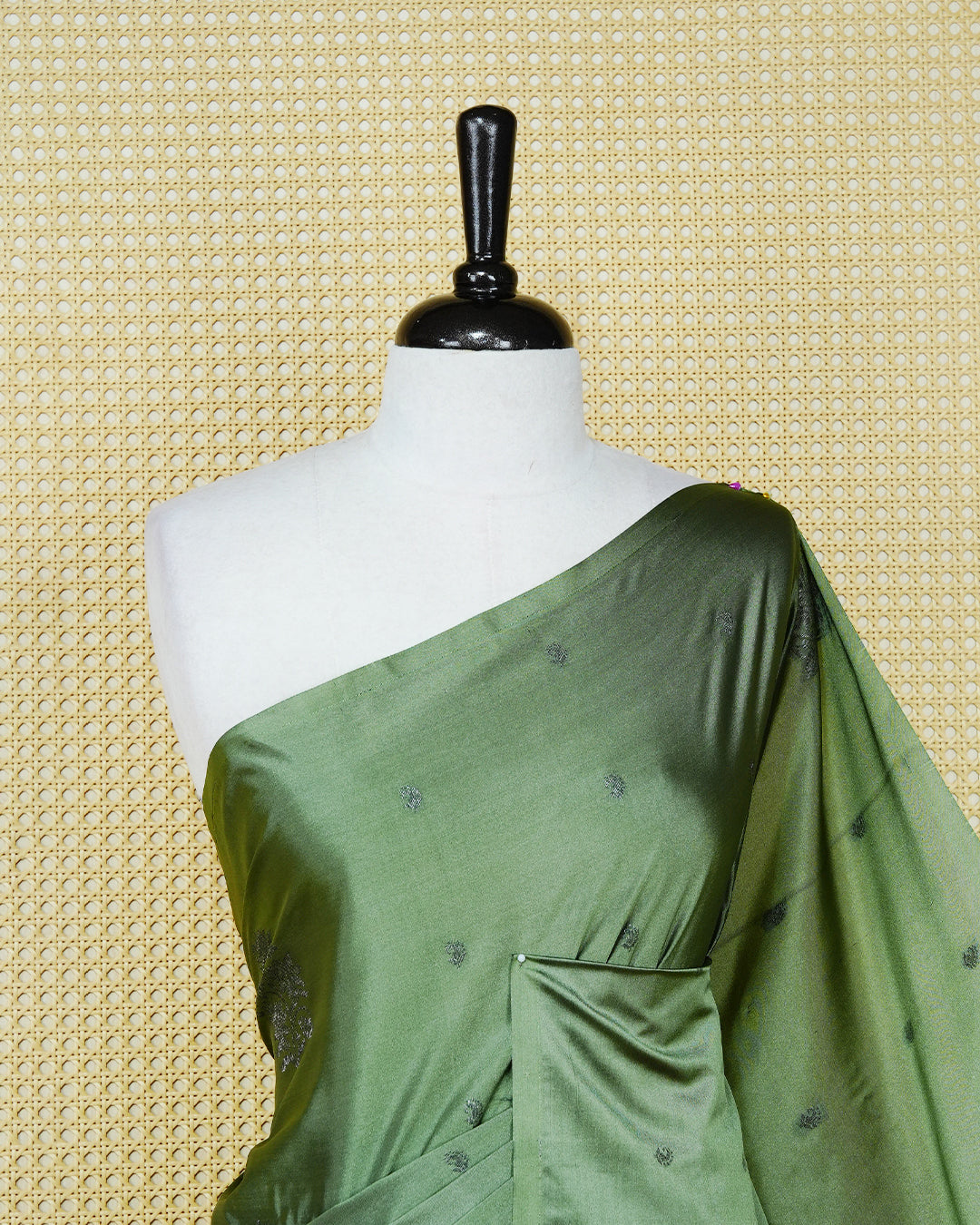 Pastel green colour soft silk saree featuring antique zari motifs on body with contrast self colour pallu & paired with matching blouse piece.