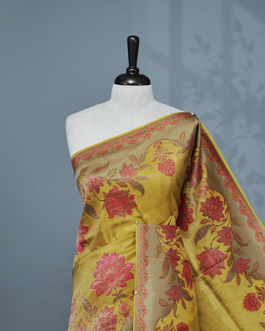 Olive yellow Colour Pashmina Saree featuring Plain body, complemented by Contrast colour with Floral pattern & gold zari on border and Pallu, comes with matching blouse piece.