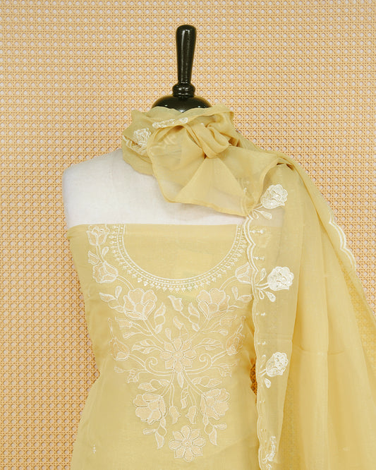 Pastal Yellow Georgette Salwar Material Features an Inrcate Floral Emproidary Pattern Aborned With Shimmering Sequin Accents, paired with matching bottom & elegant Duptta