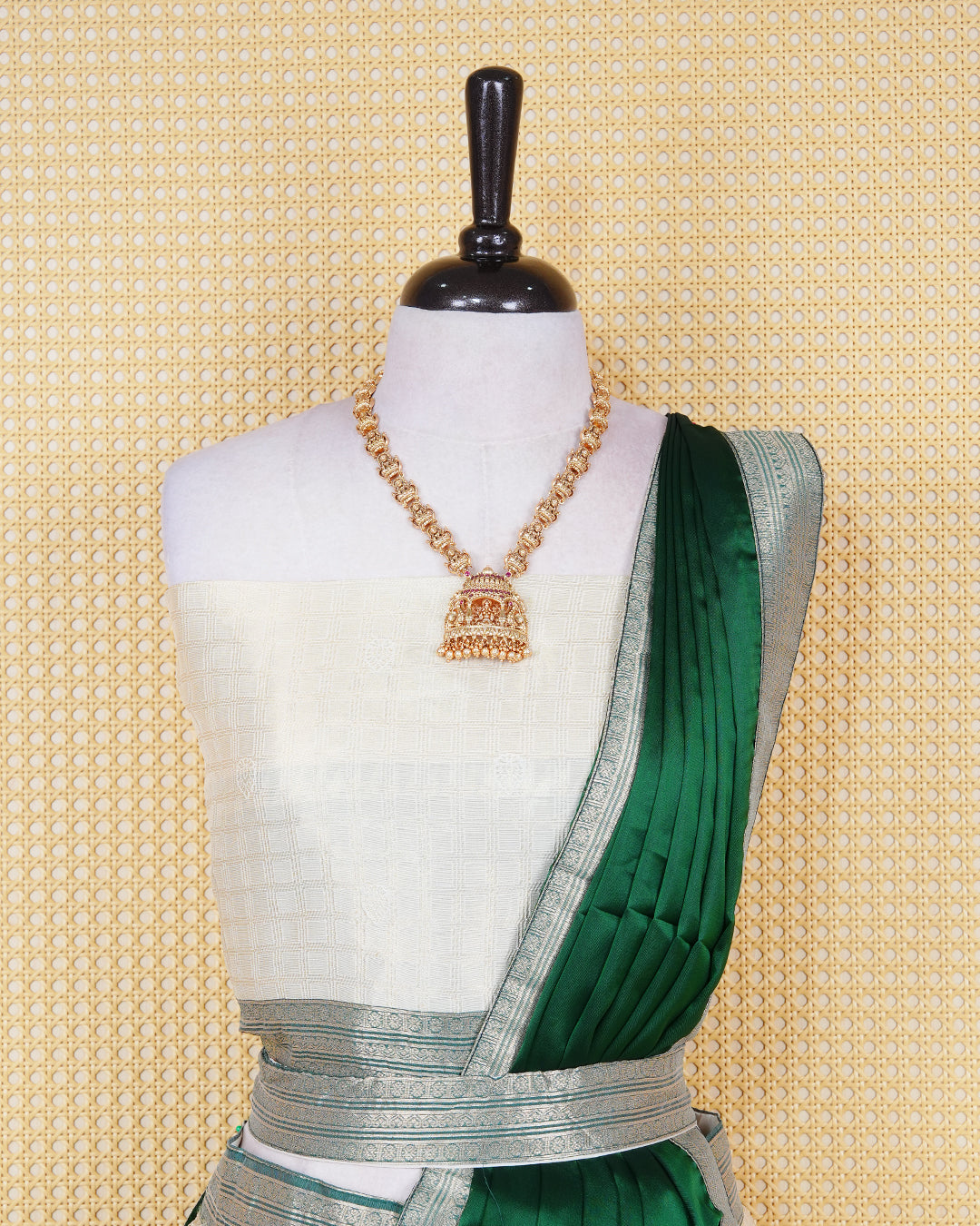Cream colour Tissue Semi stitched dhavani set featuring Gold zari check pattern on body ,contrast Green colour with gold zari bordered skirt, paired with matching blouse piece & dupatta.