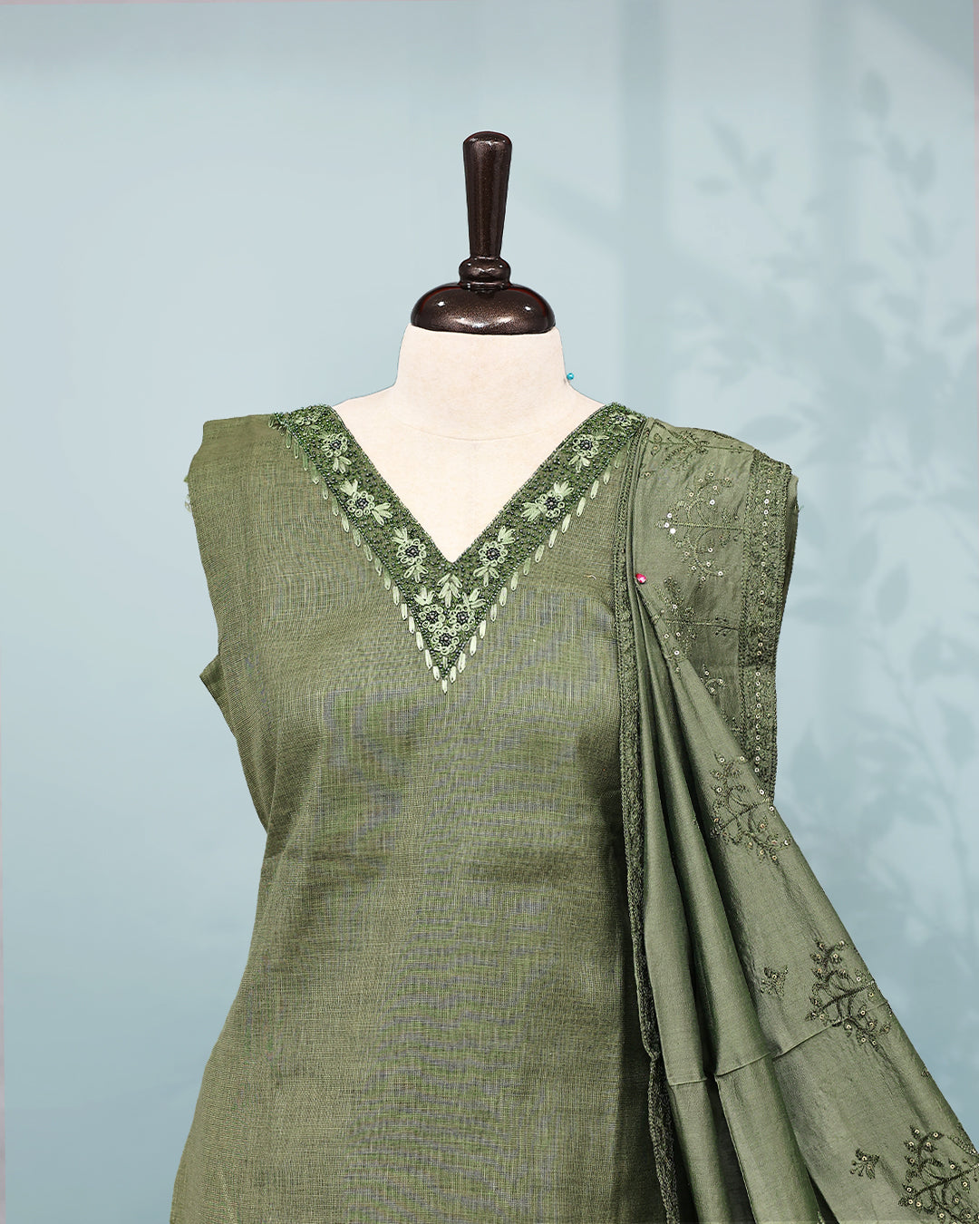 Olive green colour Salwar set comes top with Thread & beats on neck line, paired with matching bottom and dupatta.