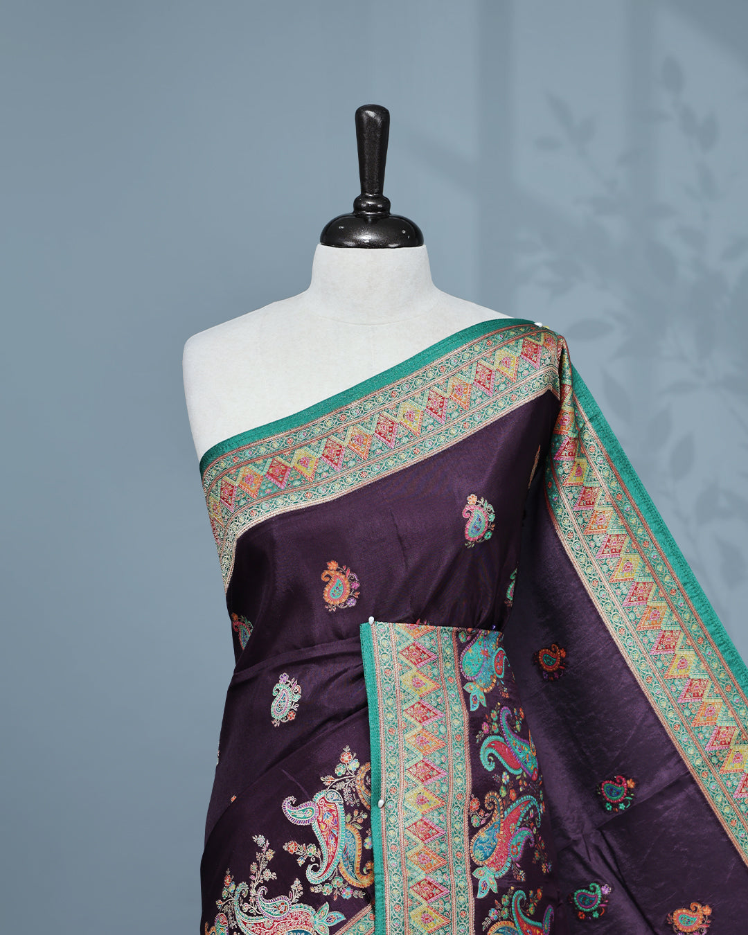 Purple Colour Pashmina Saree featuring Mango motifs on body, complemented by Contrast Green colour with Floral pattern & gold zari on border and Pallu, comes with matching blouse piece.