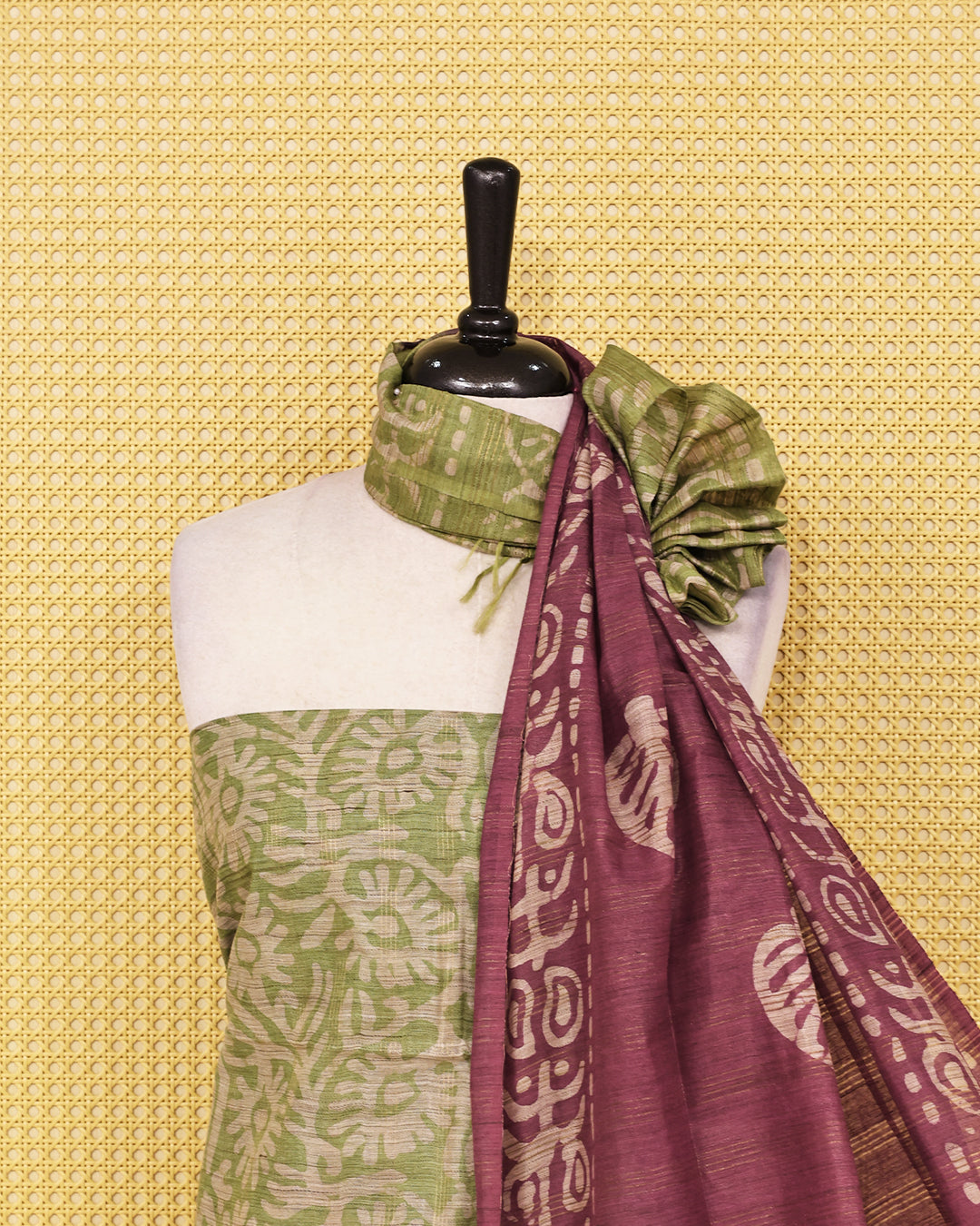 Green colour with Batik Printed  chanderi Salwar Material paired with a rich Plum Purple printed bottom and a matching contrast dupatta featuring traditional leaf motifs and artistic borders