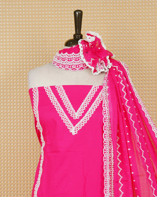 Rani pink colour Cotton Salwar Material Featuring an Threadwork on Body, lace work on neck portion, Paired With a Matching Bottom and an Elegant Dupatta.