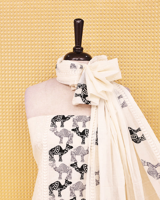 Off White colour Cotton salwar material featuring Thread Camel work on body, paired with matching bottom & dupatta.