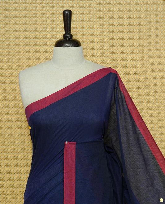 Navy Blue colour Mul cotton saree featuring Gold Sequins, complemented by Contrast Magenta simple Border & tassels.