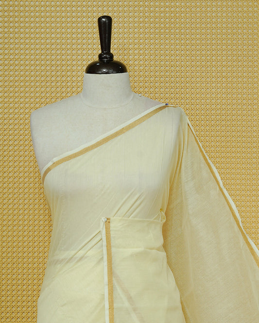 Cream Mul Cotton Saree featuring a graceful plain body with a subtle gold zari border and a finely woven striped pallu. Finished with vibrant Yellow tassels