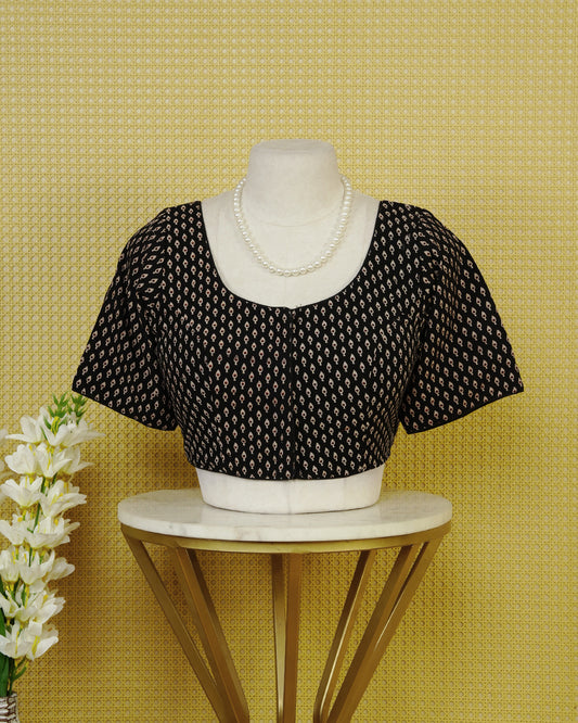 Black Colour Printed Blouse Featuring An All Over Small Teardrop Motif Pattern, Enhanced With A Round Neckline, Front Button Closure, And Short Sleeves.