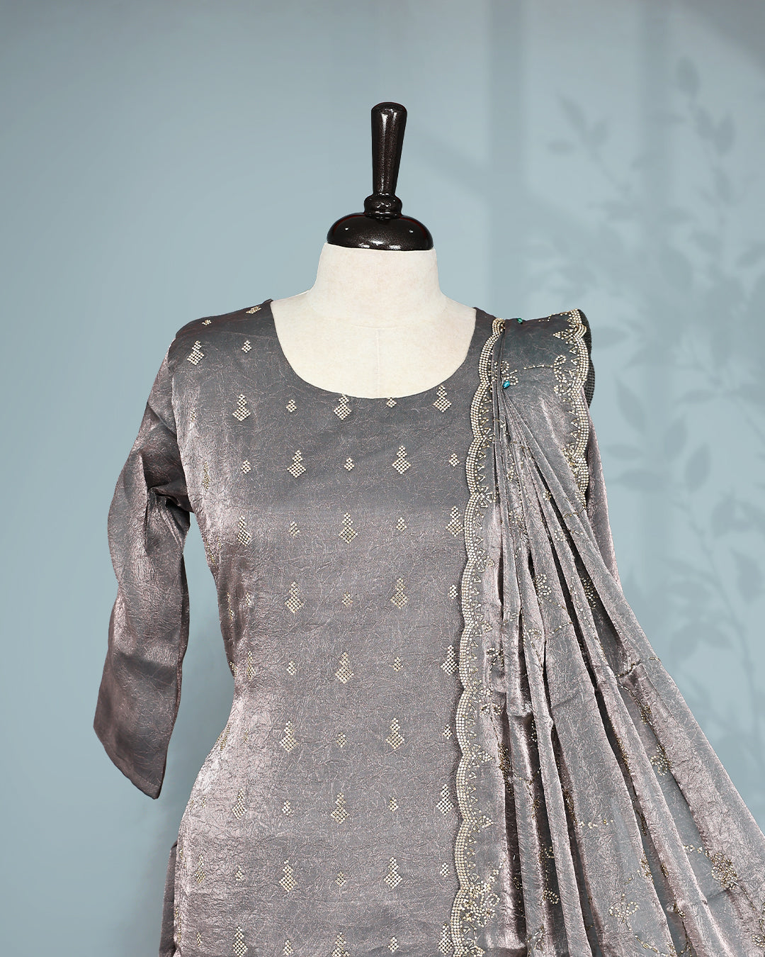 Grey colour salwar set with Stone work on top, paired with matching bottom & Dupatta.