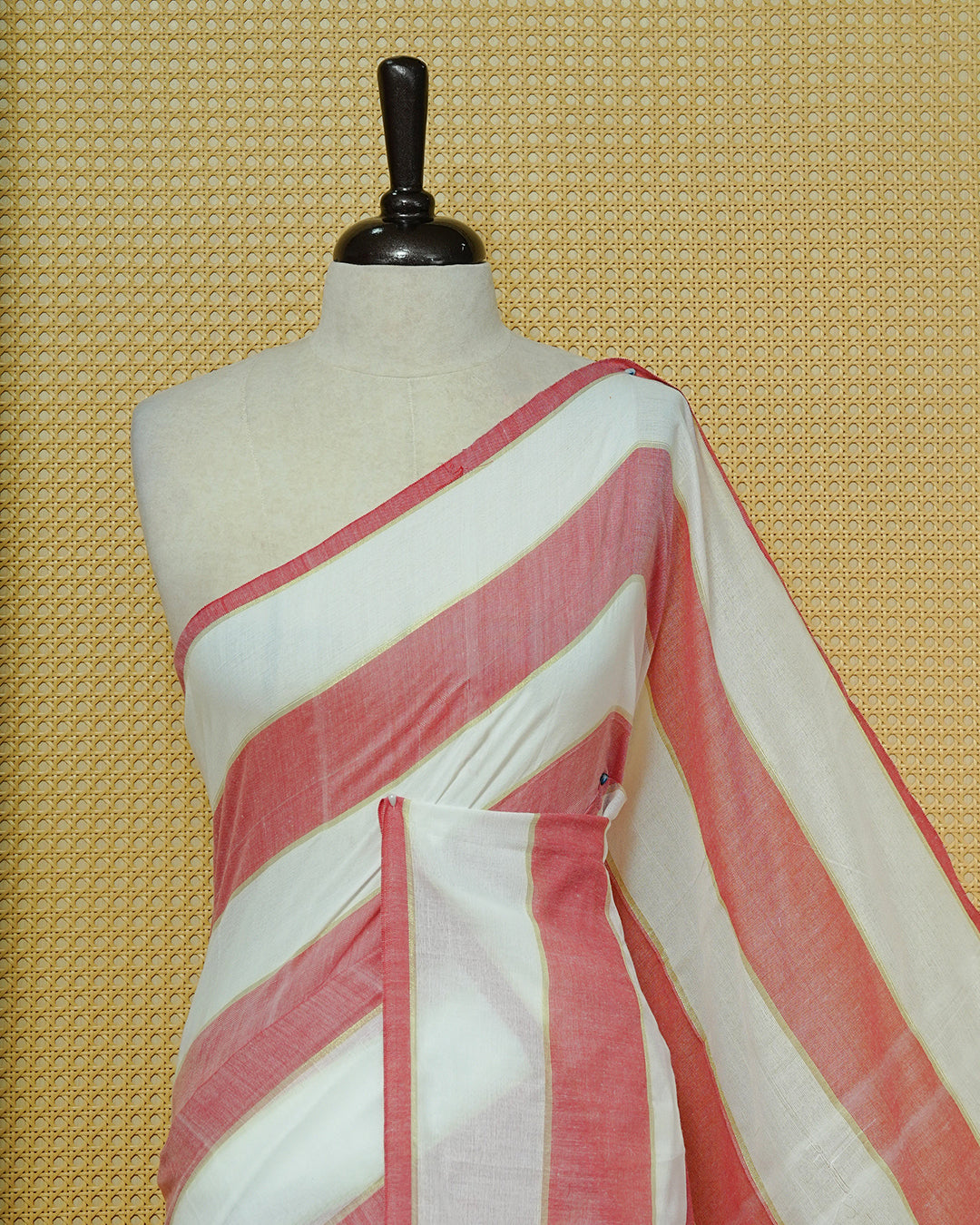 Off White & Red Striped Mul Cotton Saree featuring broad alternating white and Red Stripes, subtle zari detailing, and Finished With red tassels.
