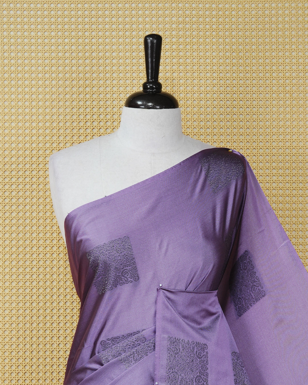 Lavender colour soft silk saree featuring antique zari motifs on body with contrast deep purple colour pallu & paired with matching blouse piece.