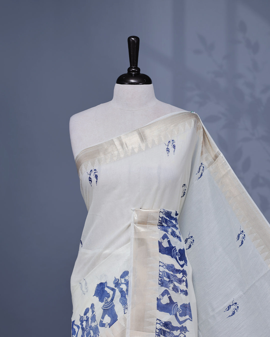 Cream colour Semi chanderi kerala saree featuring Blue colour Print on body, complemented by Light Gold zari Border, paired with matching blouse piece.