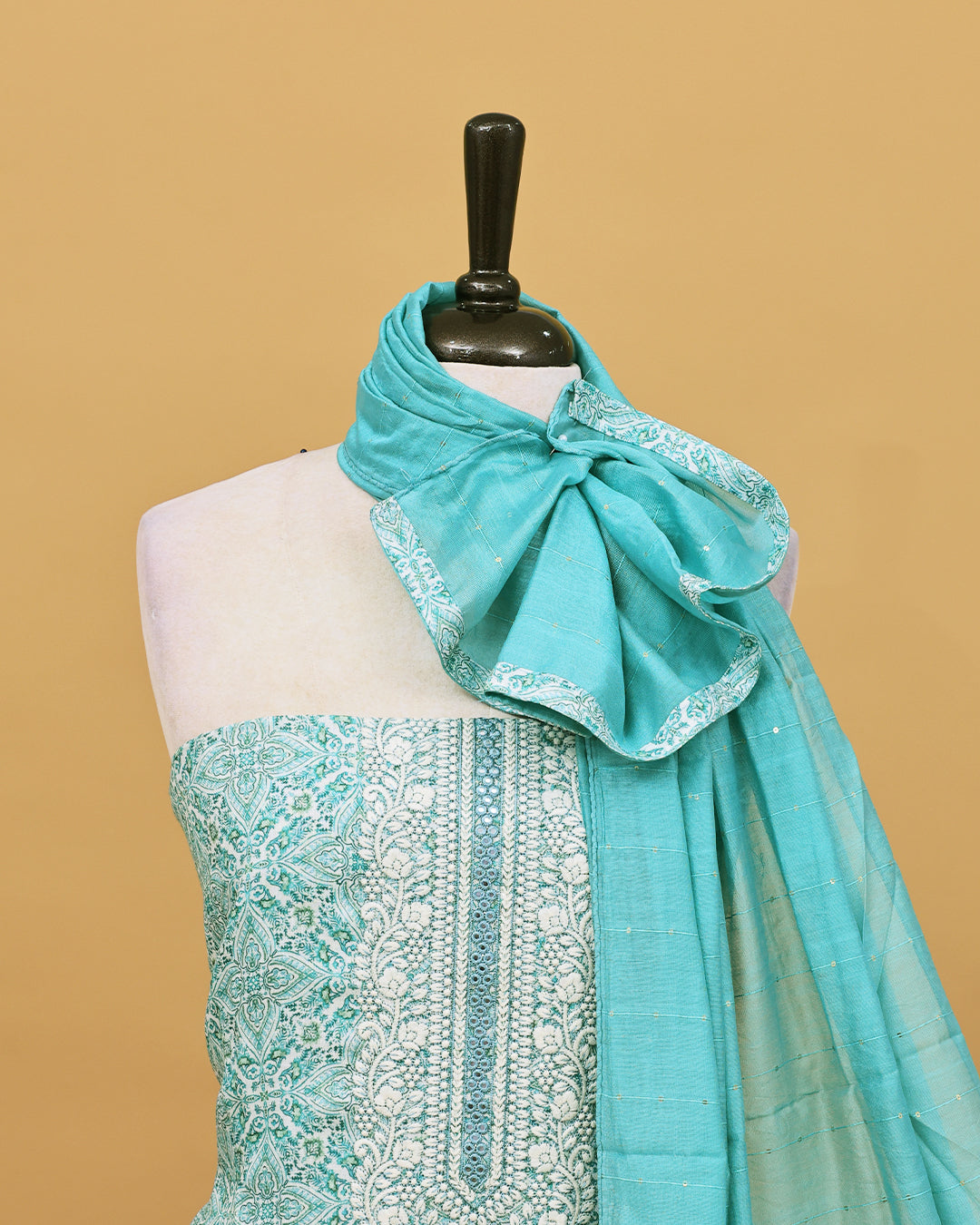 Cream colour Net cotton Salwar material with Green colour floral kodi pattern work on body, matching bottom & Dupatta.