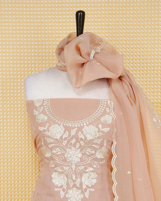 Dusty Rose Georgette Salwar Material Features an Inrcate Floral Emproidary Pattern Aborned With Shimmering Sequin Accents, paired with matching bottom & elegant Duptta