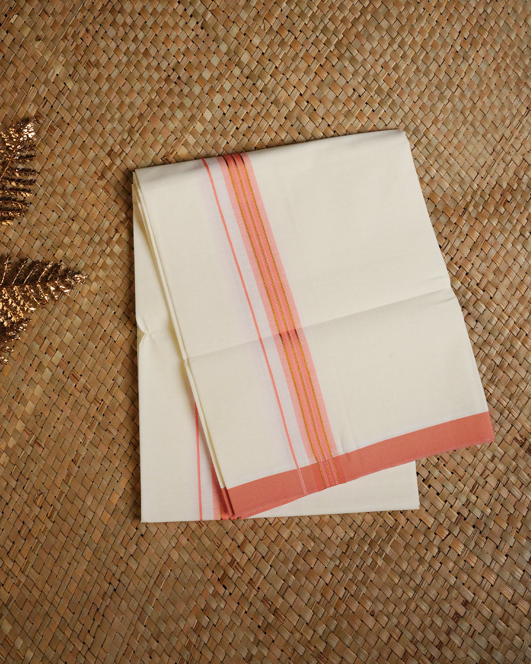 Cream colour cotton single dhoti featuring Peach colour with gold zari border.