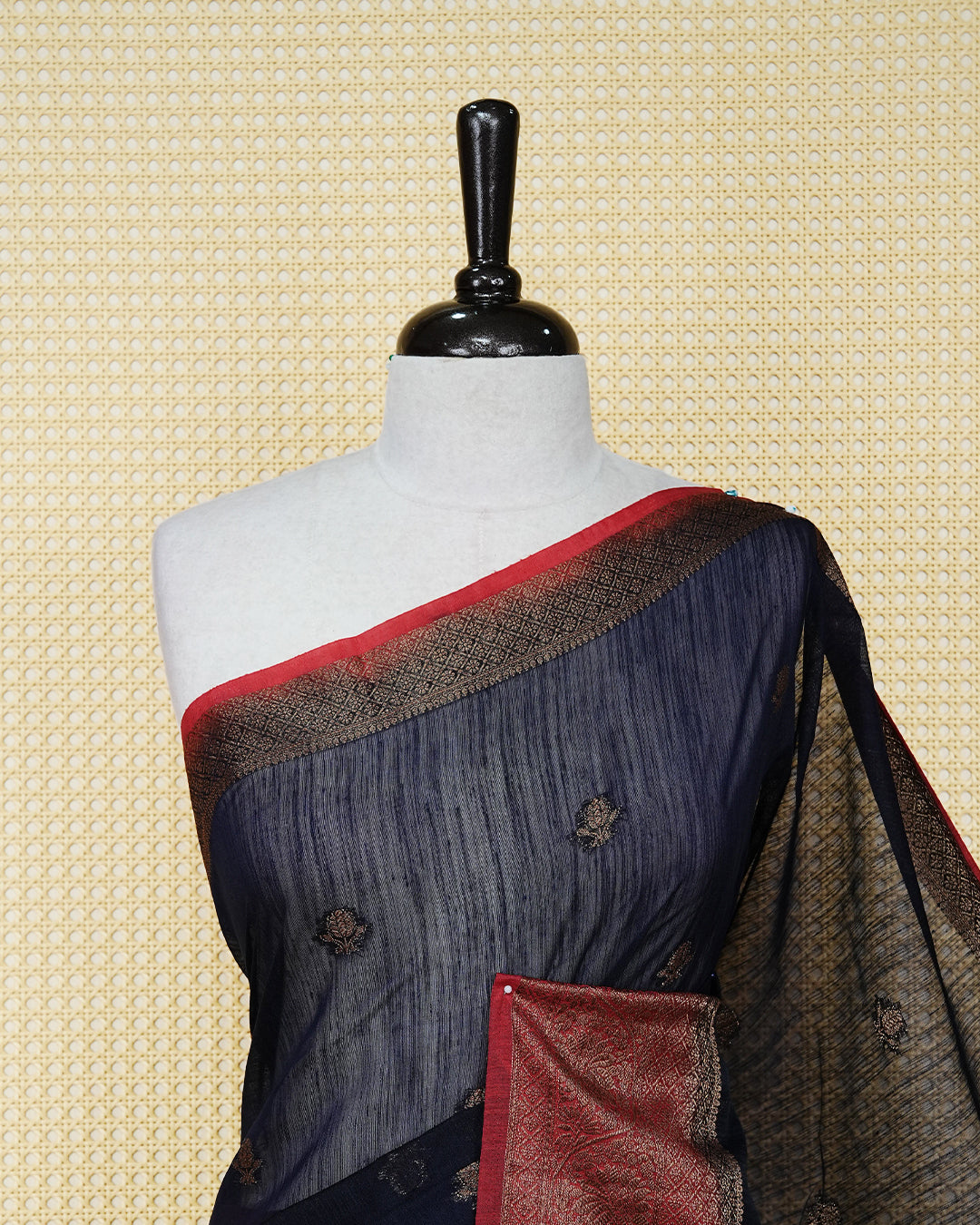 Navy blue colour semi linen saree thread motifs on body, contrast red colour gold zari border, rich pallu comes with matching blouse piece