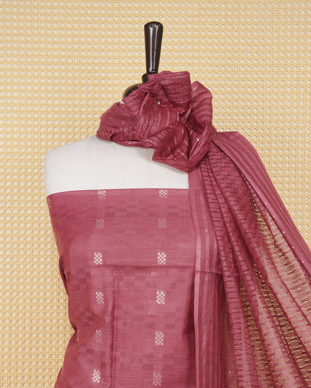 Maroon colour silk cotton salwar material featuring gold zari design without border, paired with matching bottom and beautiful dupatta.