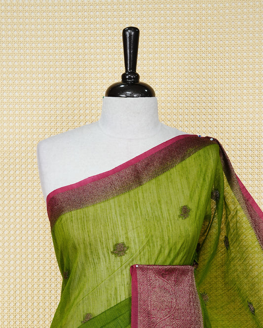 Parrot green colour semi linen saree thread motifs on body, contrast pink colour gold zari border, rich pallu comes with matching blouse piece