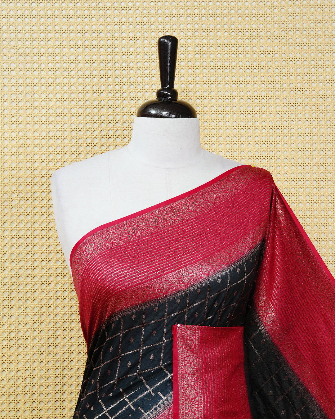 Black Colour Semi georgette Saree having zari check with buttas pattern on body, contrast red colour floral designed border, Rich Pallu comes with Matching Blouse piece.
